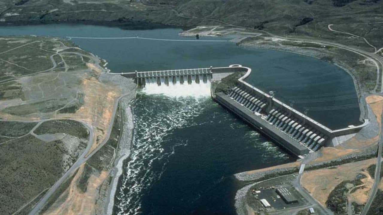 Aerial view of hydropower works in a mountain valley