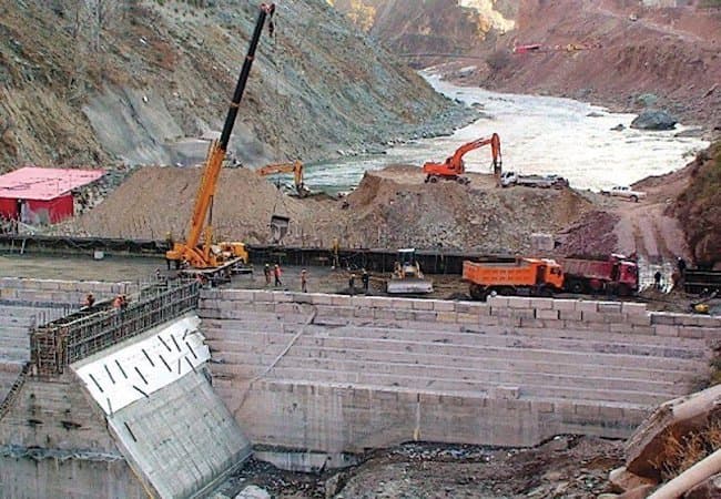 Construction work beside the Indus River at the Dasu Hydropower Project